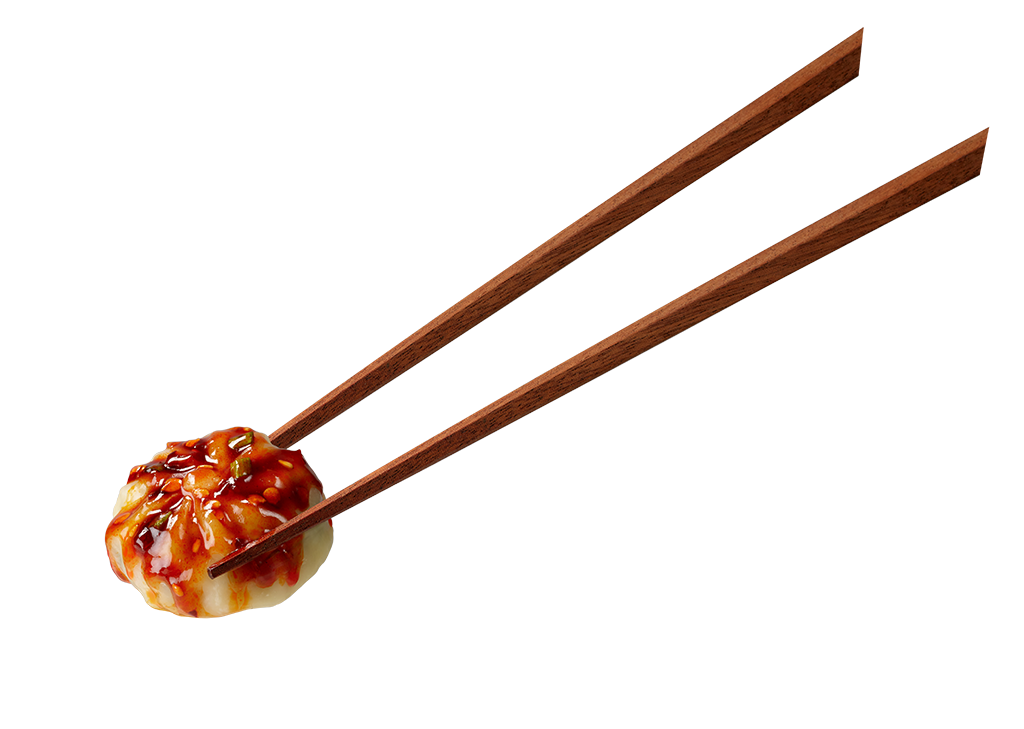 chopsticks holding a dumpling